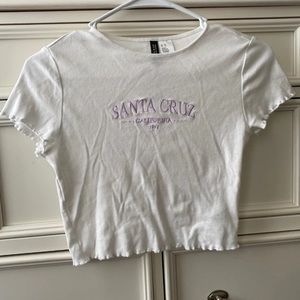 Embroidered white lettuce-edge baby tee
